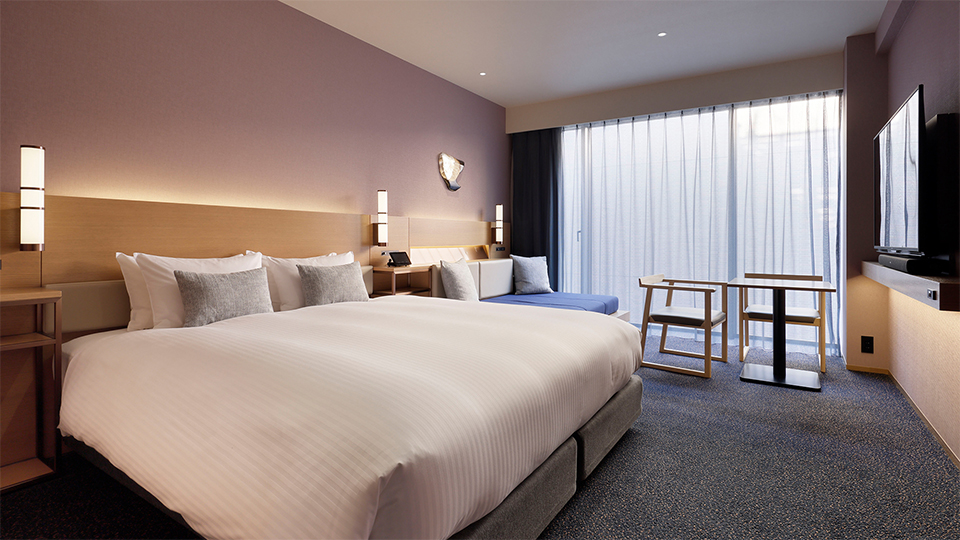 The Superior , 1bed King (+ extra) room features a king-size bed, a comfortable sofa seating area, a desk, and a large window.